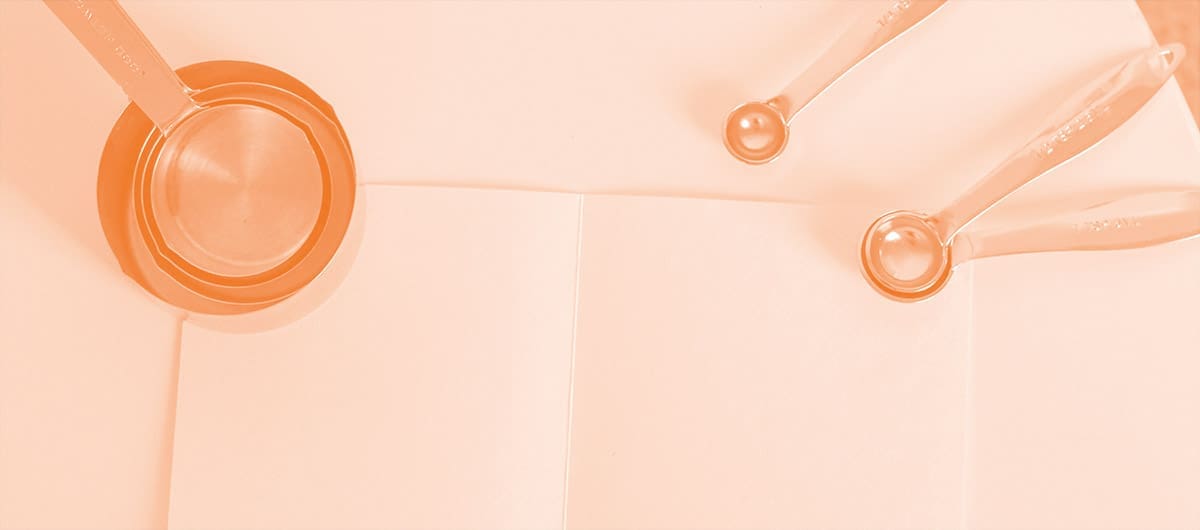 A paper towel with measuring cups and spoons sitting on top