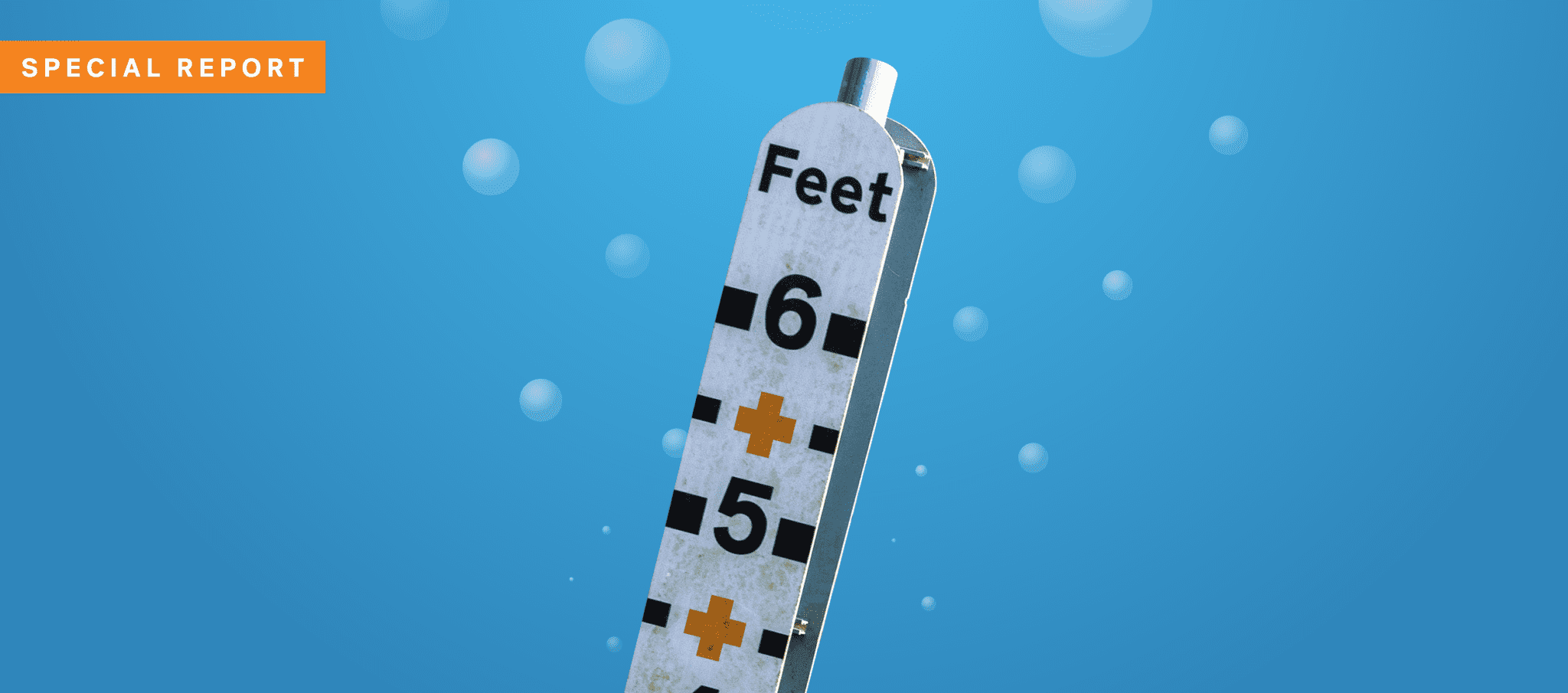 A depth gauge underwater, showing up to 6 feet